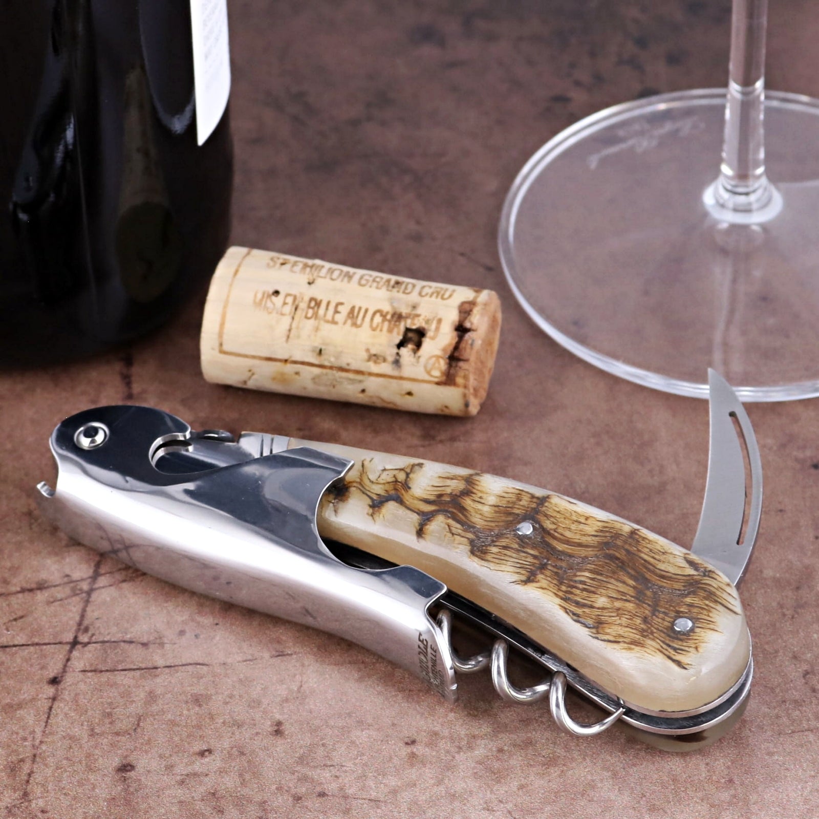 Laguiole Magnum Ram Horn Corkscrew, close-up of polished steel and textured natural ram horn handle.