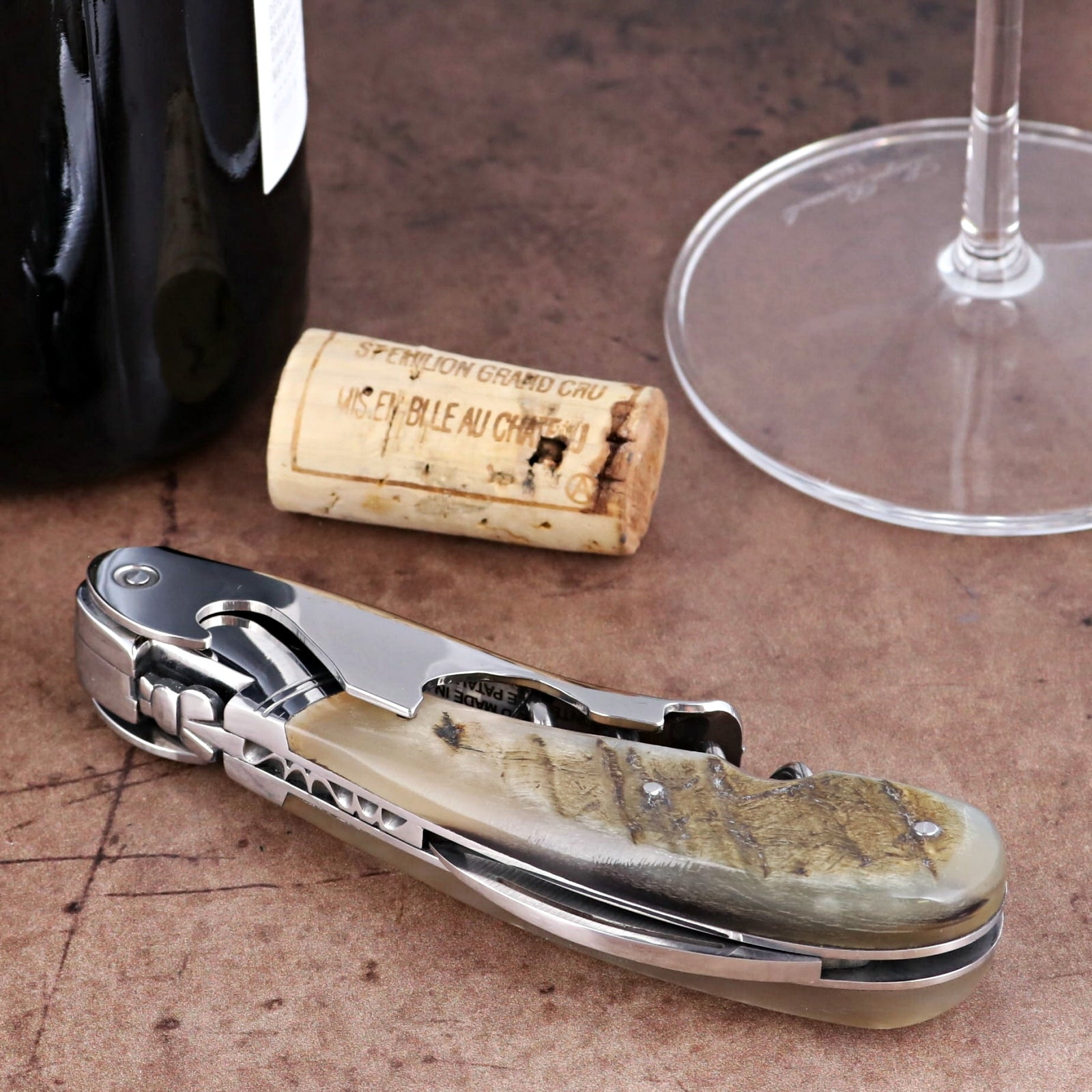 Laguiole Magnum Ram Horn Corkscrew, close-up of polished steel and textured natural ram horn handle.