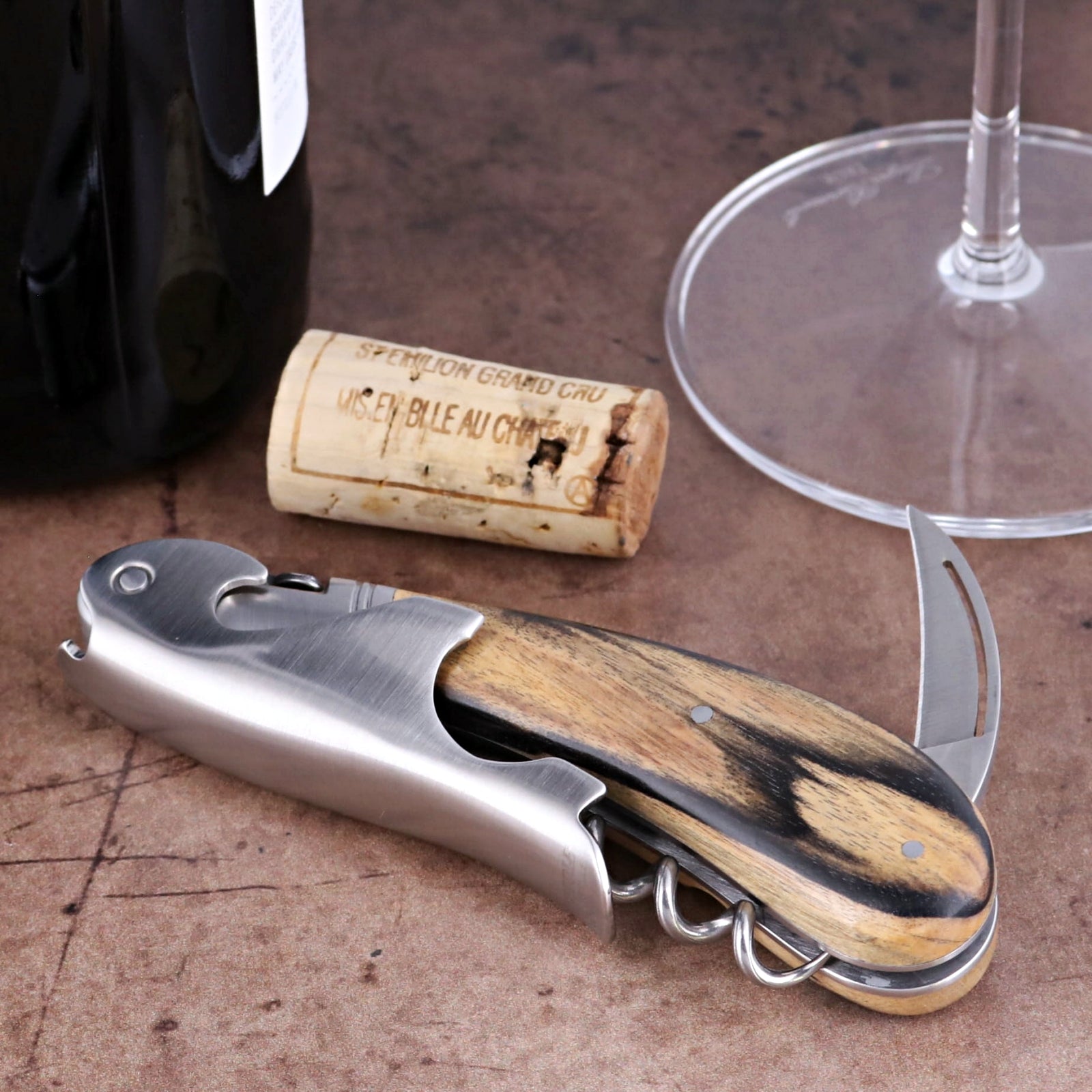 Laguiole Magnum Royal Ebony Corkscrew, close-up side view showing polished steel and wood handle.