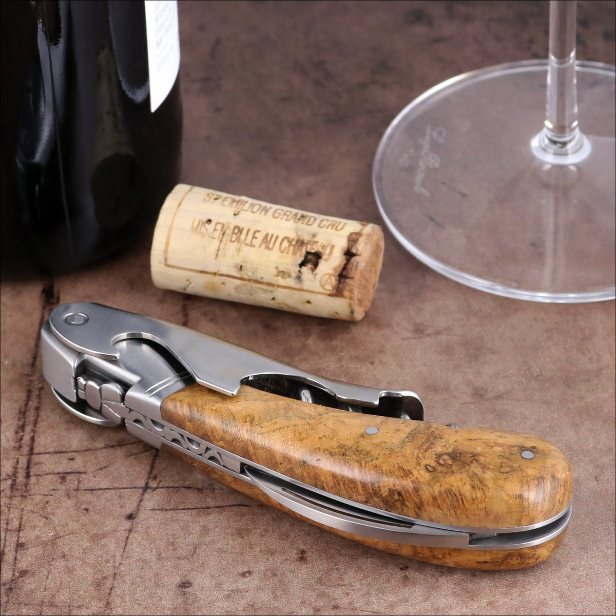 Laguiole Magnum Burled Teak Corkscrew, side view showing polished steel and natural wood grain handle.