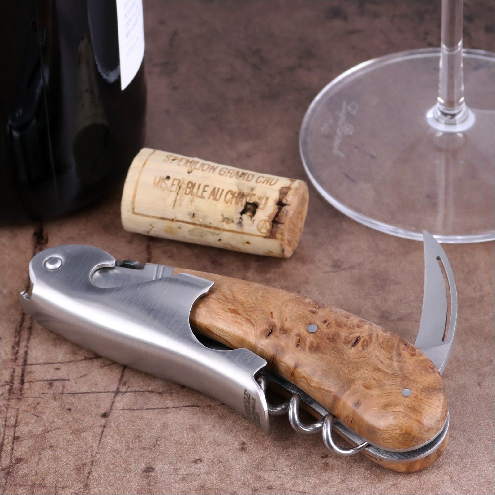 Laguiole Magnum Teak Corkscrew close-up featuring a polished steel body and natural teak wood handle.