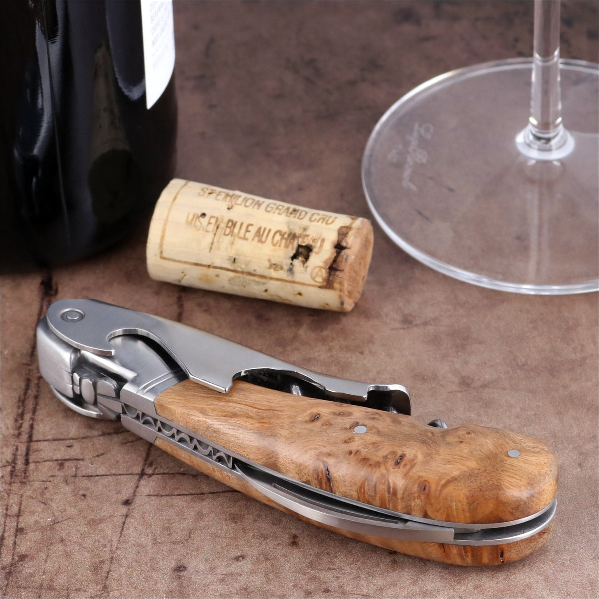 Laguiole Magnum Teak Corkscrew, close-up side view showing polished steel and natural wood handle.