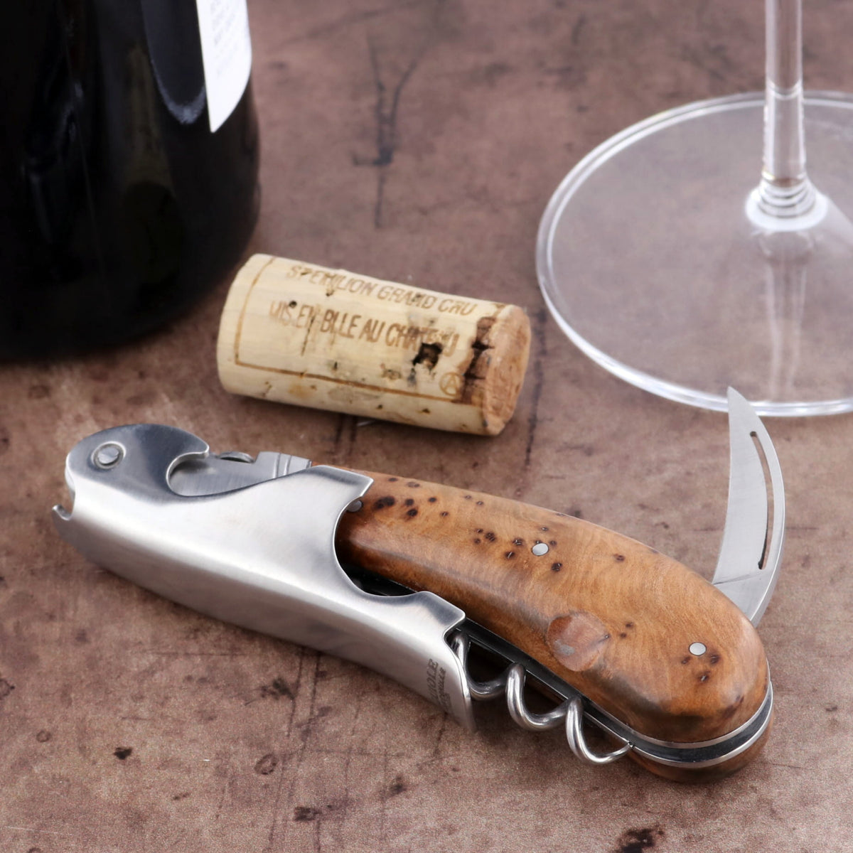 Laguiole Magnum Thuya Burl Corkscrew, close-up of the wood handle, foil cutter, and worm.