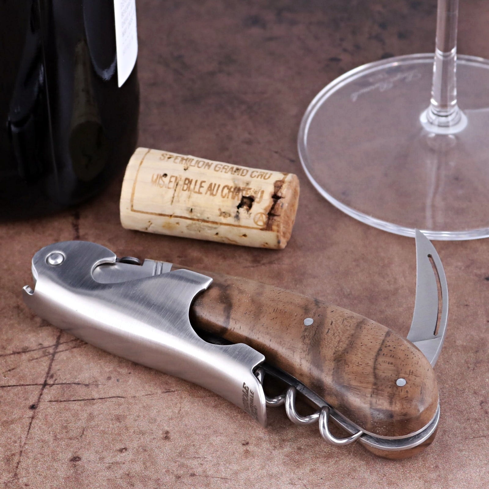 Laguiole Magnum Walnut Corkscrew close-up featuring a polished steel body and rich walnut wood handle.