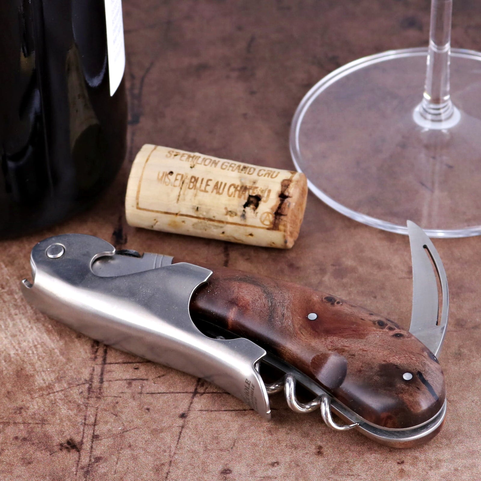 Laguiole Magnum Walnut Corkscrew, close-up side view showing polished steel and dark wood handle.