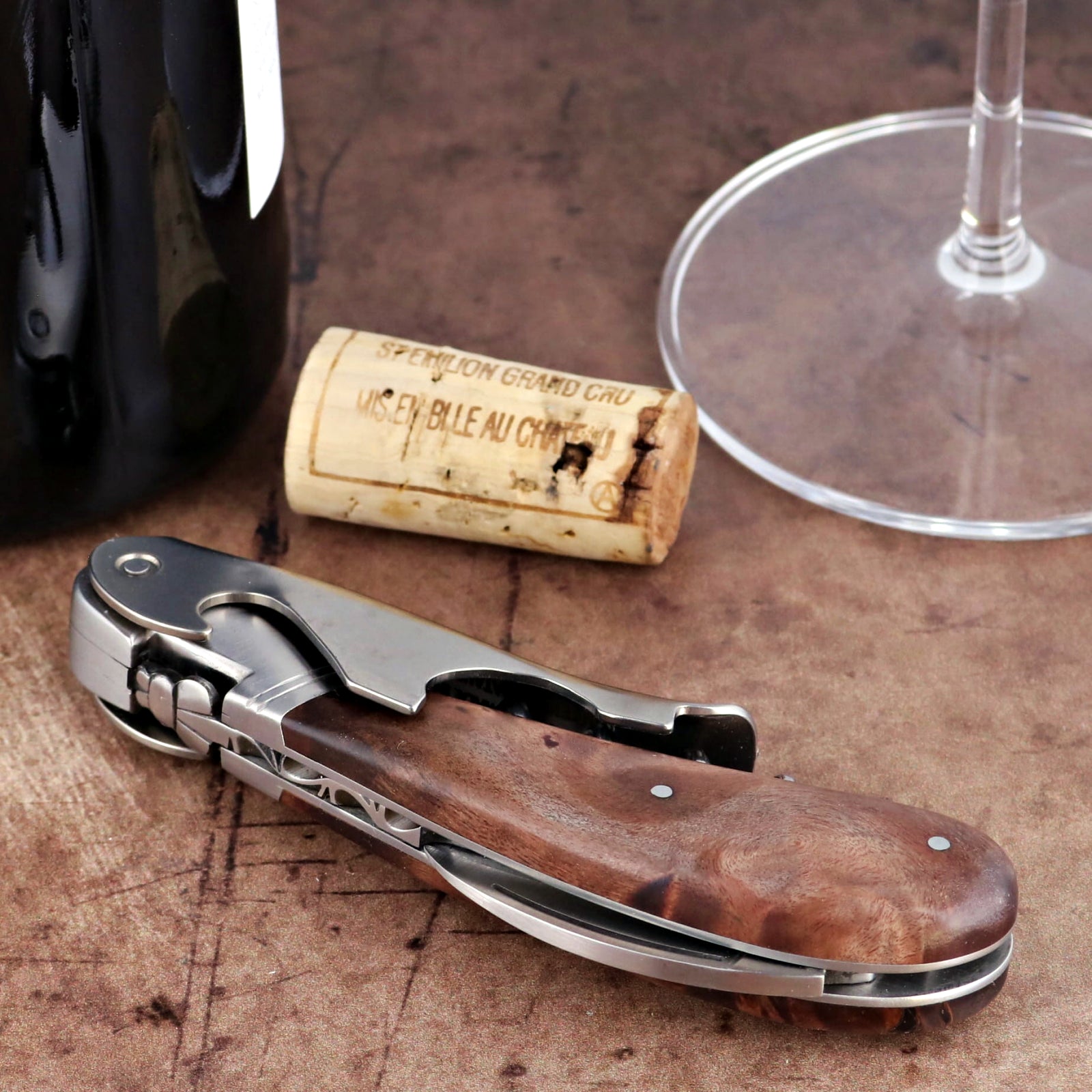 Laguiole Magnum Walnut Corkscrew, close-up side view showing polished steel and dark wood handle.