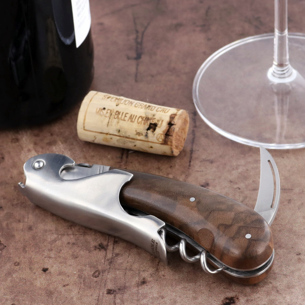 Laguiole Magnum Walnut Corkscrew, close-up of stainless steel body and rich brown walnut handle.