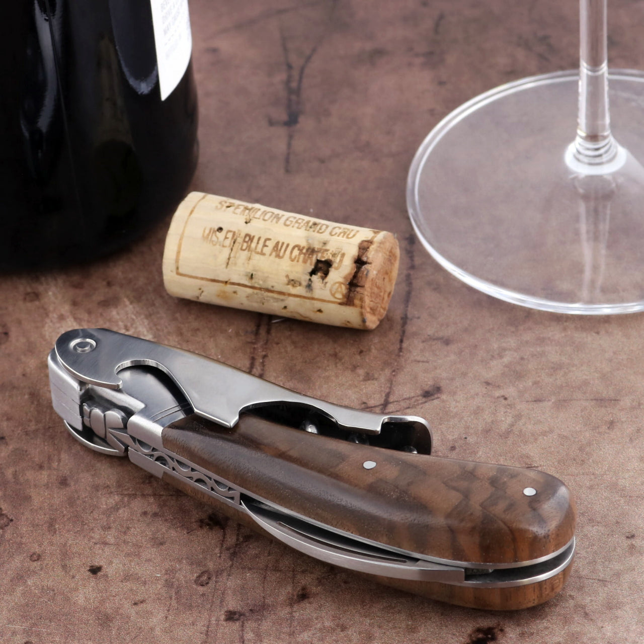 Laguiole Magnum Walnut Corkscrew, close-up of stainless steel body and rich brown walnut handle.