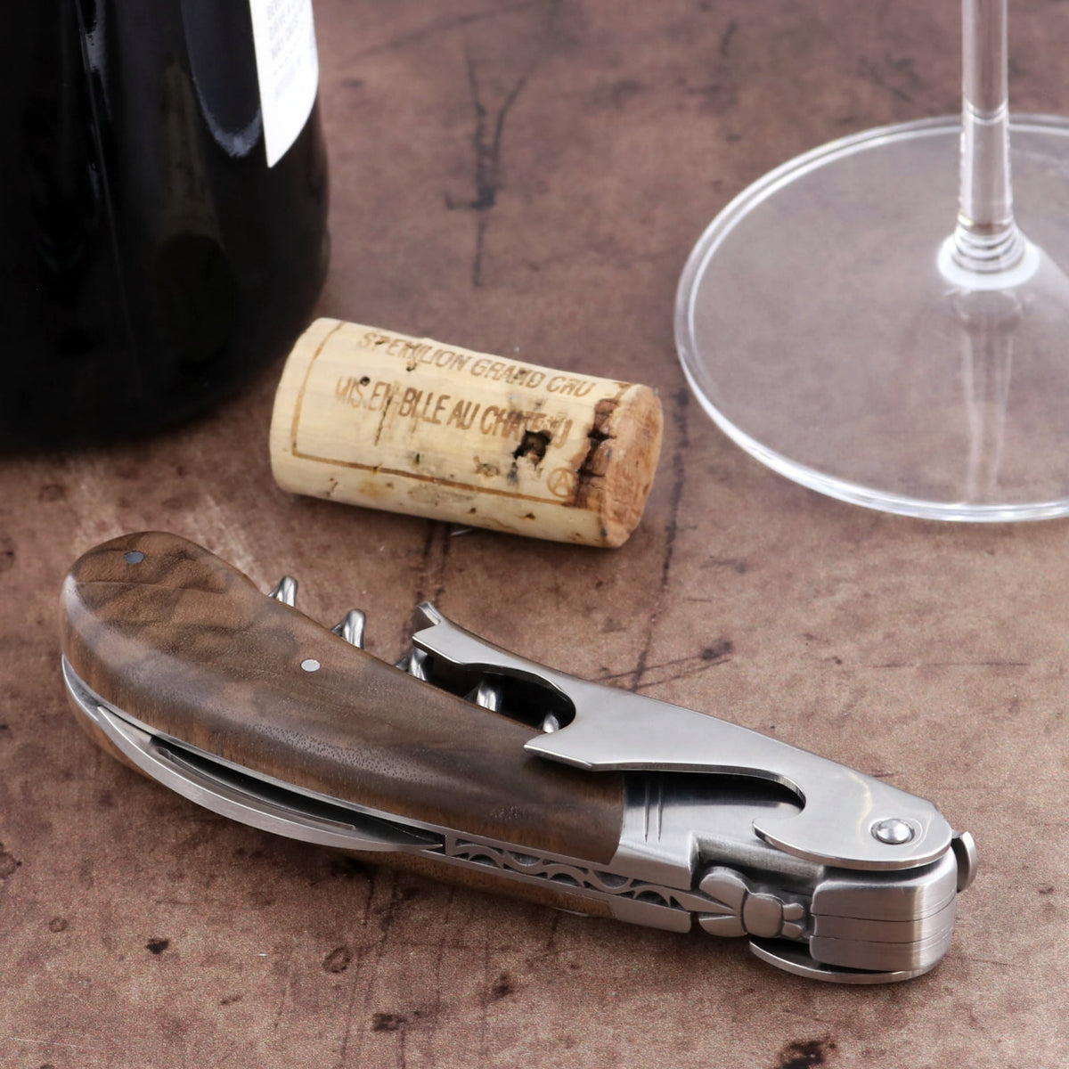 Laguiole Magnum Walnut Corkscrew, close-up of the elegant walnut handle and stainless steel tools.