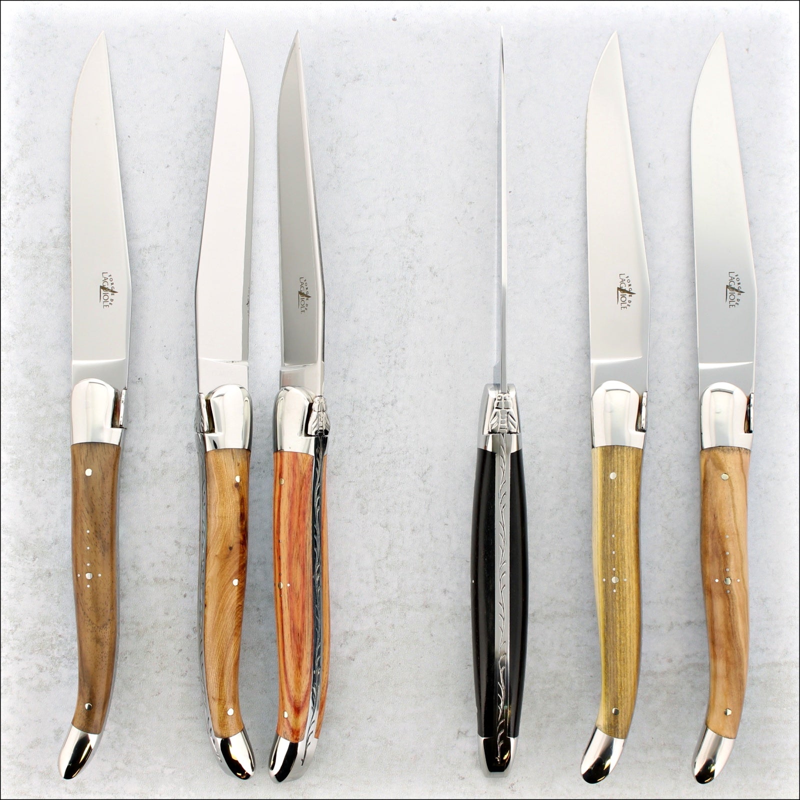 to view of a set of mixed handle laguiole steak knives