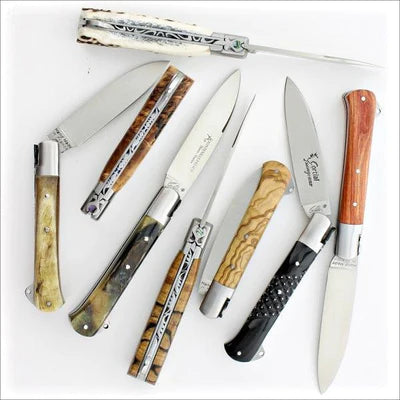 several Yssingeaux Classic Pocket Knives on a white bacground