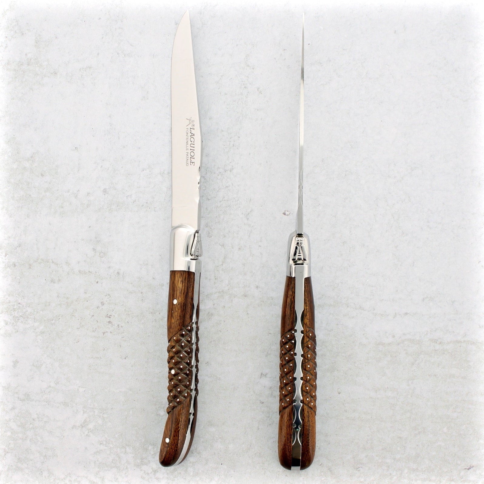 https://www.laguiole-imports.com/cdn/shop/products/Laguiole-Forged-Steak-Knives-Studded-Desert-Ironwood-Set-of-2-Fontenille-Pataud.jpg?v=1666213647